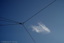 Lonely cloud in the sky with wires