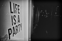 Life is a party sign, street, monochrome, fotografo milano